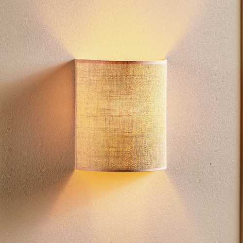 Jute wall lamp mounted under a covered balcao in a coastal Goa home - Akway