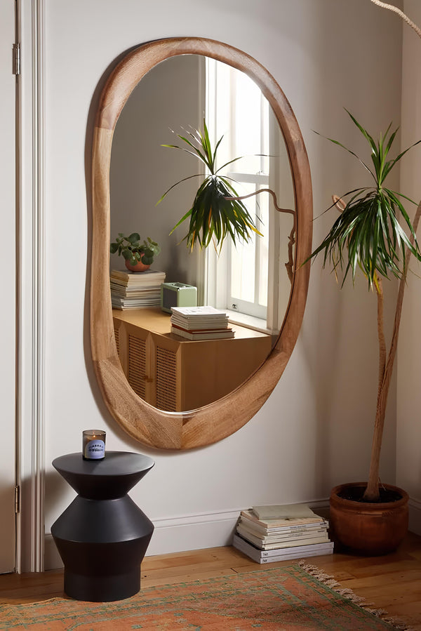 Large rattan wall mirror as a statement piece in an Indian living room - Akway