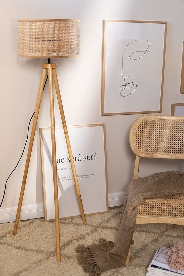 Rattan cane floor lamp glowing with warm white light